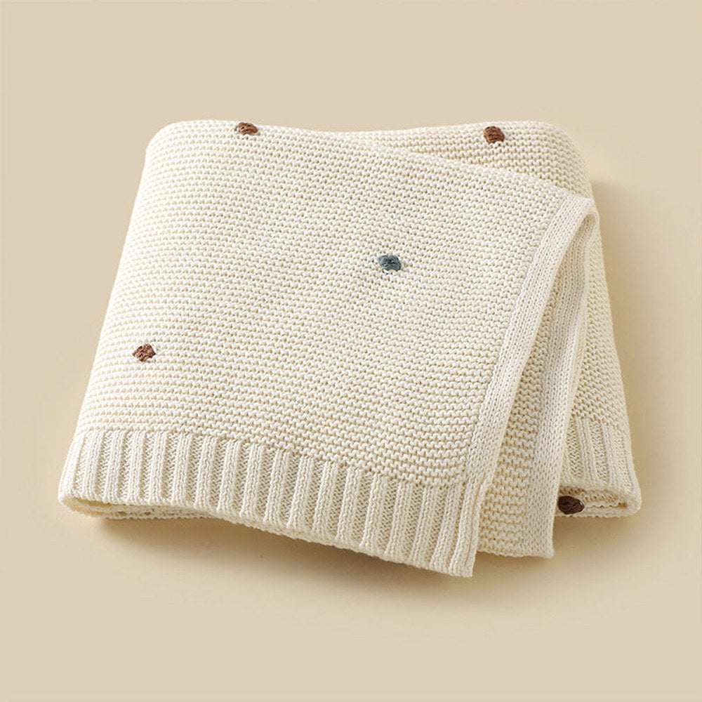 Knitted Solid Color Baby Blanket With Hand-Embroidered Pom Poms