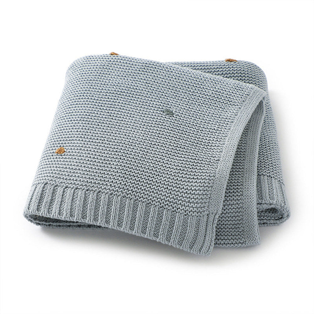 Knitted Solid Color Baby Blanket With Hand-Embroidered Pom Poms