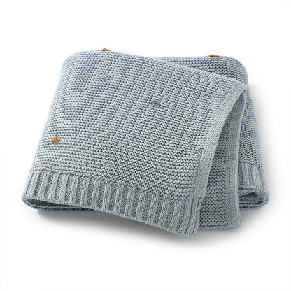 Knitted Solid Color Baby Blanket With Hand-Embroidered Pom Poms