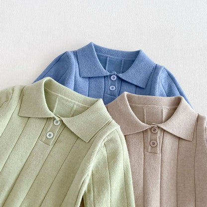 Close-up of the turn-down collar and two-button placket in blue, green and apricot