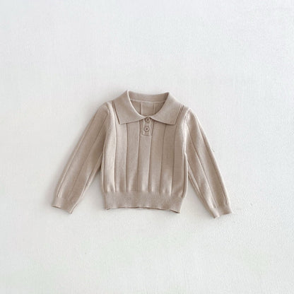 Baby polo shirt in apricot, front view