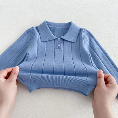 Ribbed hem and cuffs of the blue baby polo shirt