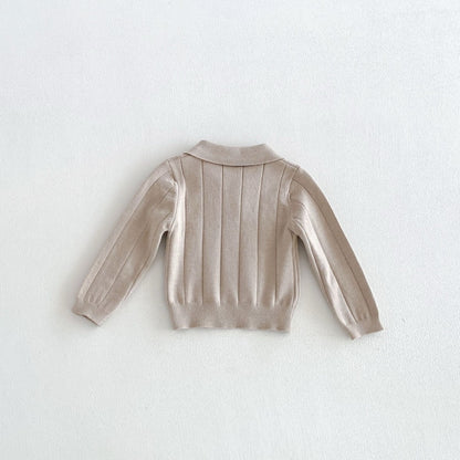 Baby polo shirt in apricot, back view