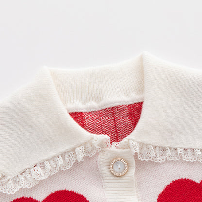 Mameluco de punto de manga larga con cuello de muñeca y gráfico de corazón de bebé 