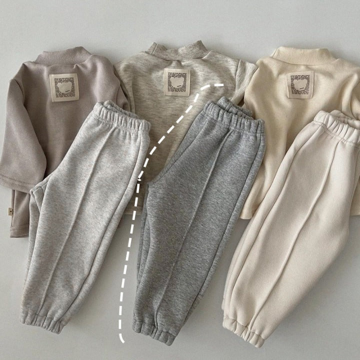 Pantalones de chándal cálidos gruesos de lana suelta de color sólido para bebé en otoño 